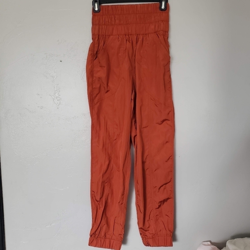 Free People Movement NWOT Womens XS The Way Home Metallic Dark Orange Track Pant
